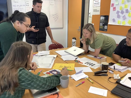 EmployNZ staff members working with ako aoteara facilitator in a classroom